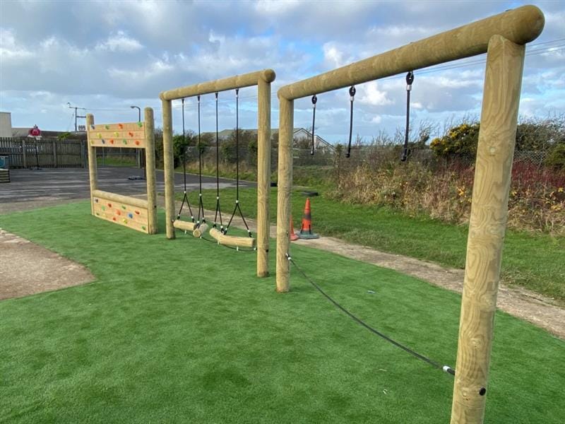 a view of our individual trim trail items on the green artificial grass surfacing below