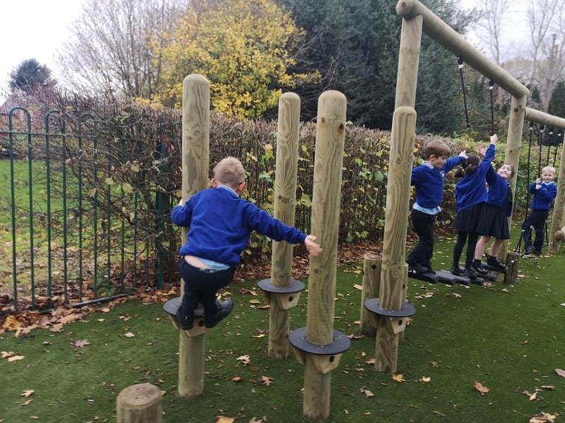 Child balancing on trim trail equipment