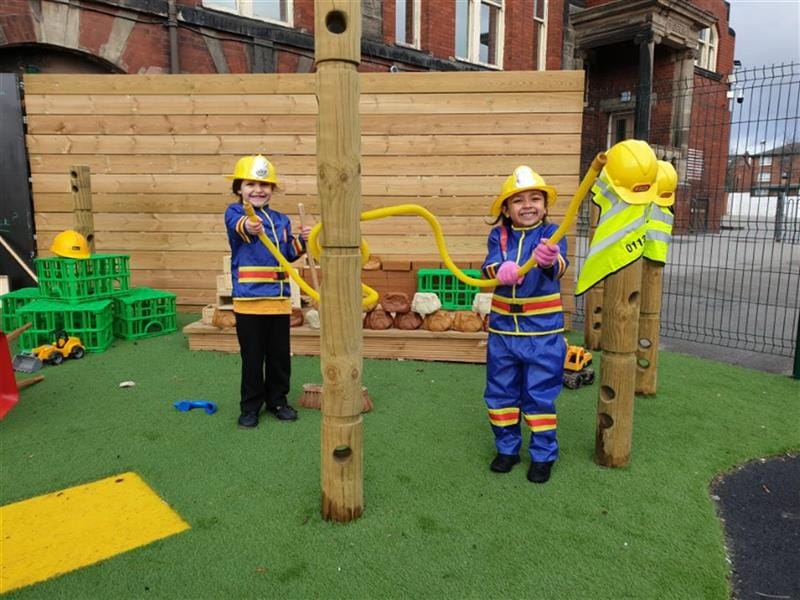 two children dress up and play a role play game in the den-making posts