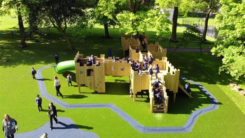 a birds eye view of the playground castle with children playing on it 