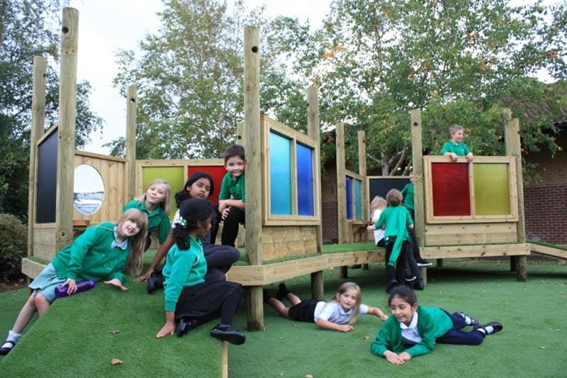 Children playing together on Pentagon Play's Imagination Station
