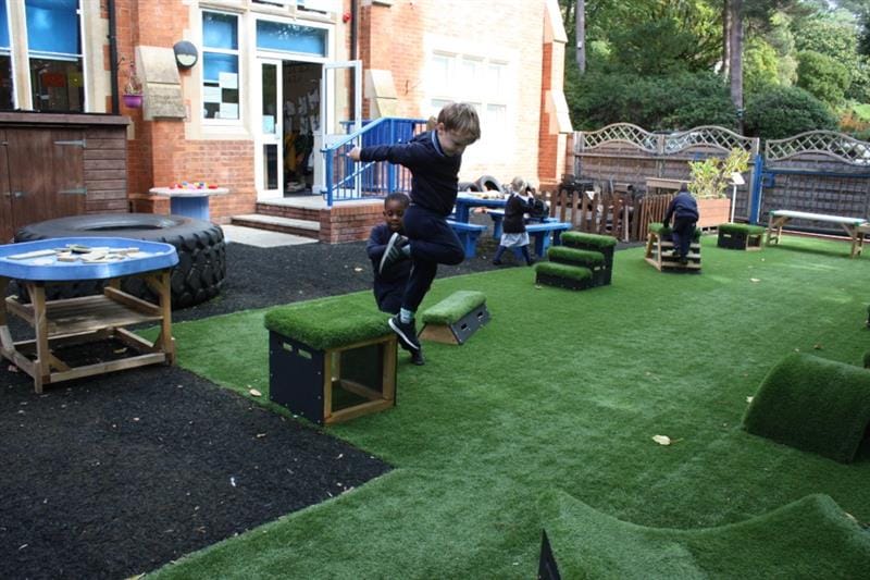 a child jumps off a get set go block