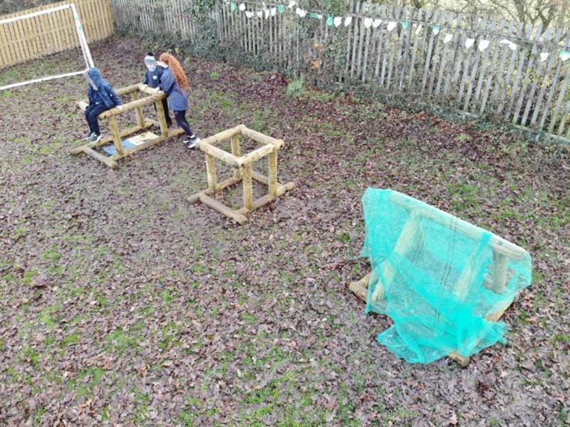 Children sitting on top of in-out shapes for sen schools