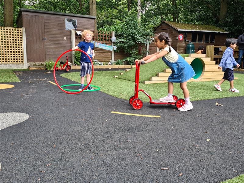 children playing on scooter on our roadway surfacing