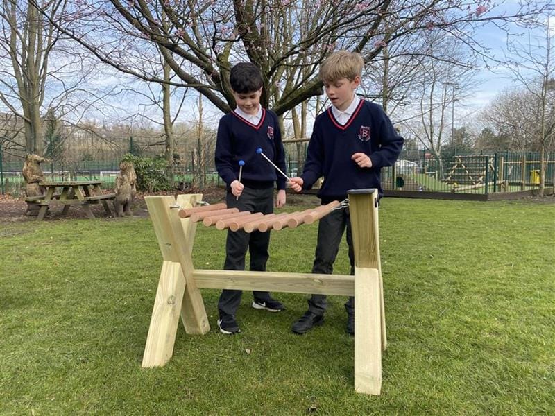 2 children playing on the musical marimba