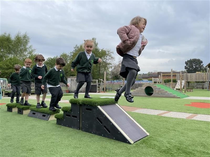 children leap off the GSGB onto the floor below