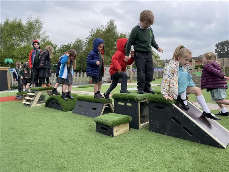 children run around and play on the get set go block sets and slide down the slide block in the get set go block set