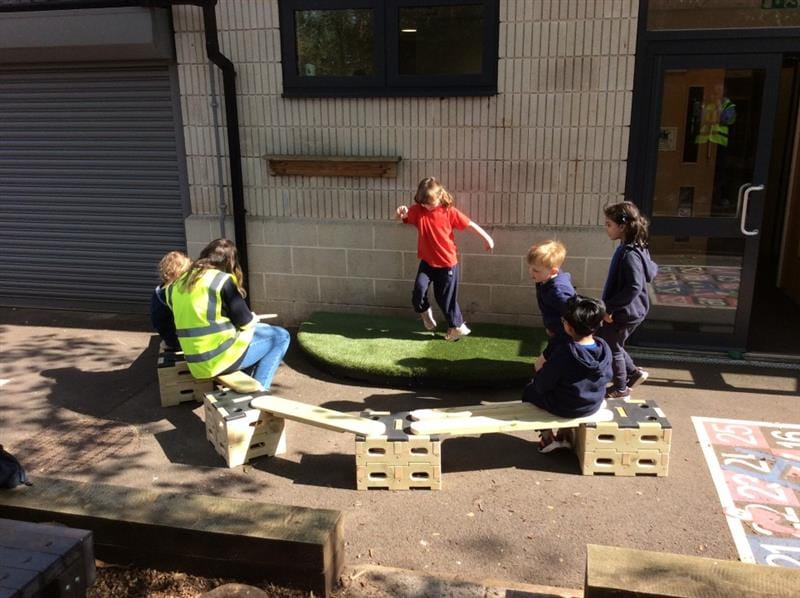 a little girl dances for her friends on the stage