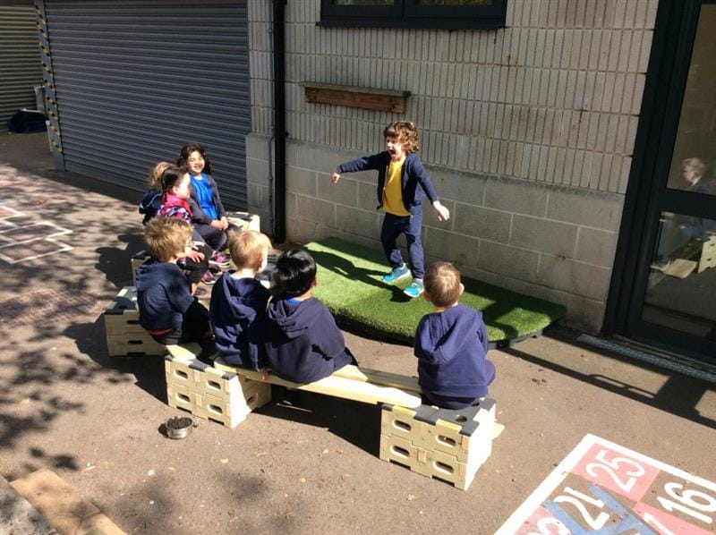 a child does a talent show performance for his friends