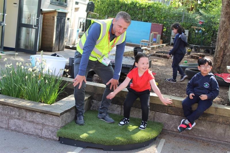 our founder, Andy, dances with a girl on the freestanding stage quadrant