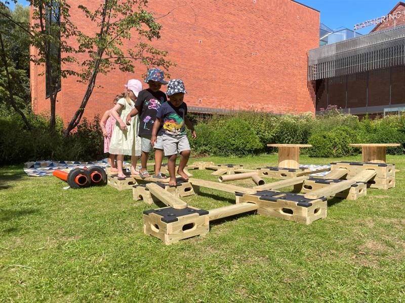 children make a trail from the play builder and follow it round