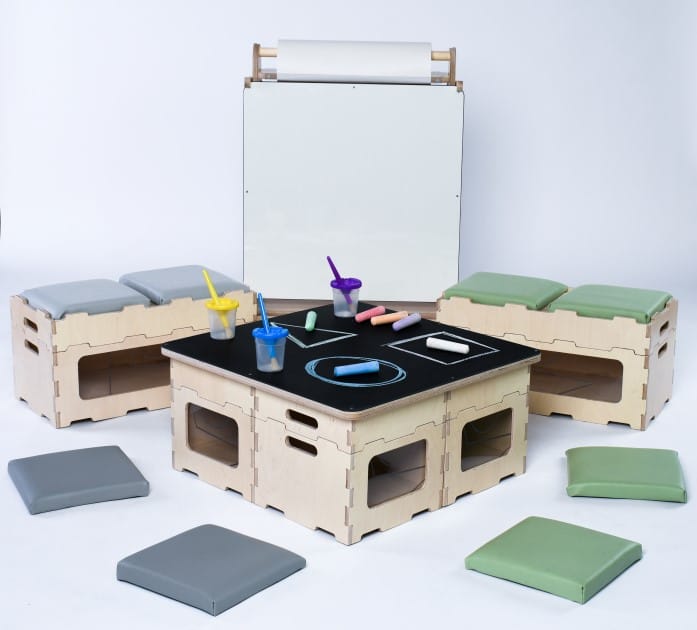 A picture which shows a selection of our indoor classroom furniture, such as stack and sit blocks, stack and sit benches, indoor art easel