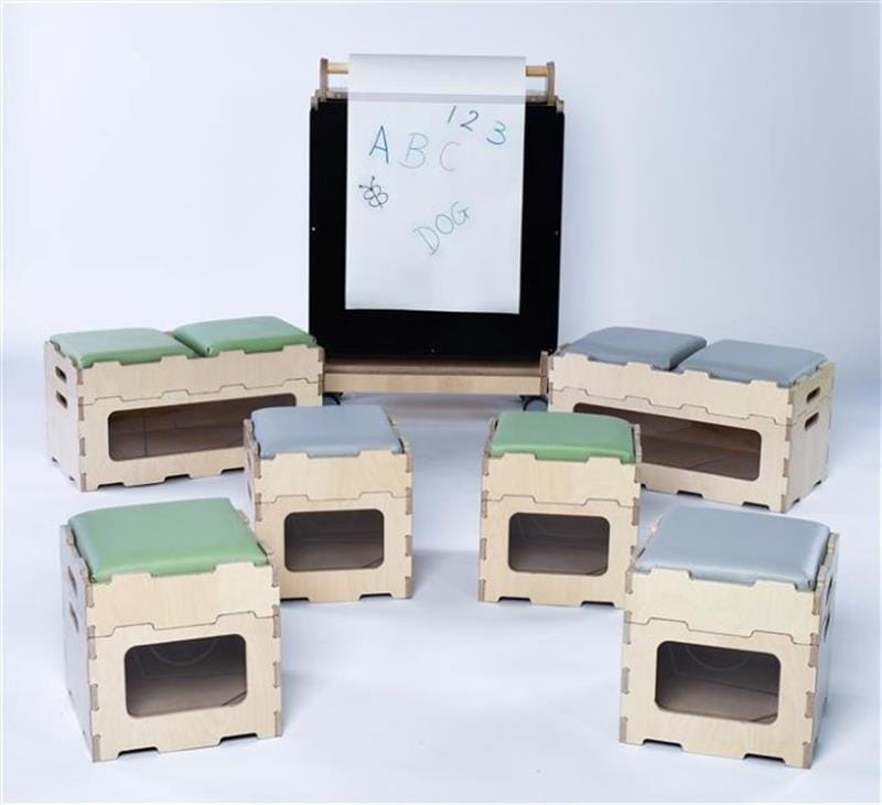 the easel sits neatly behind the empty stack and sit stools and benches