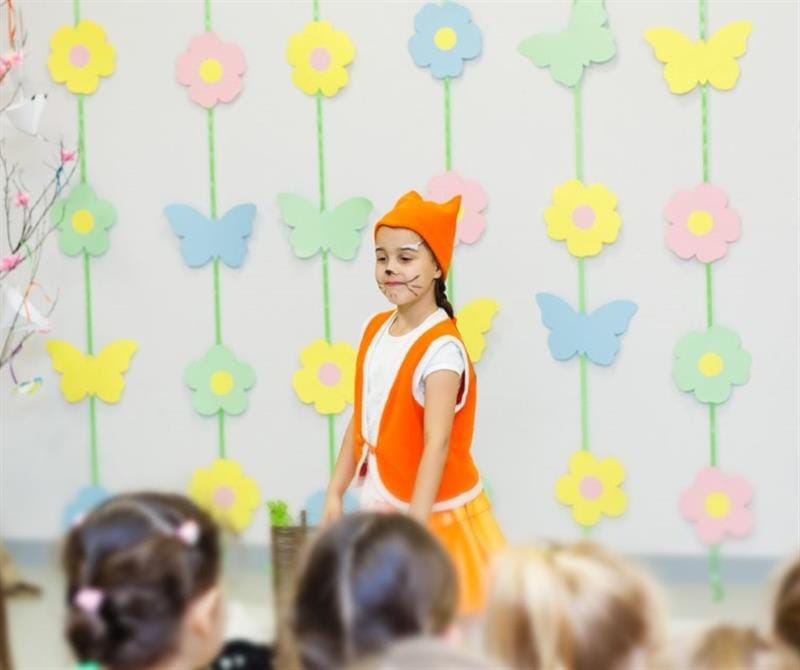 a little girl dressed as a fox