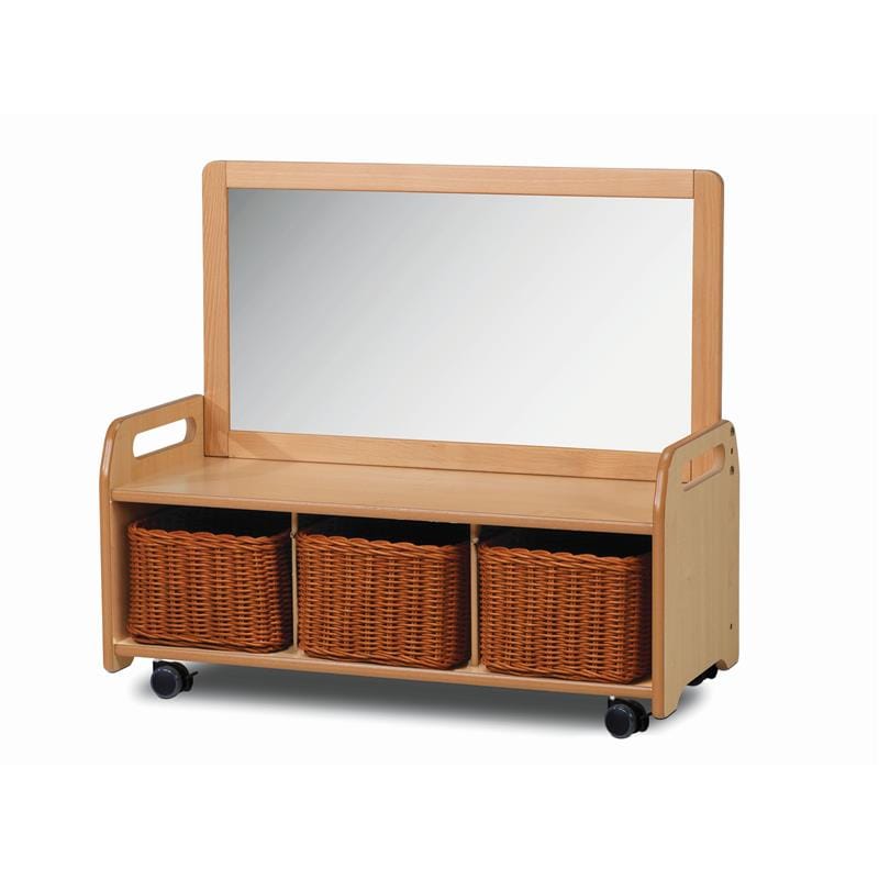 A low storage unit on wheels that has handles on the top left and right of the unit. Placed on the top to create a right angle, a mirror has been attached/