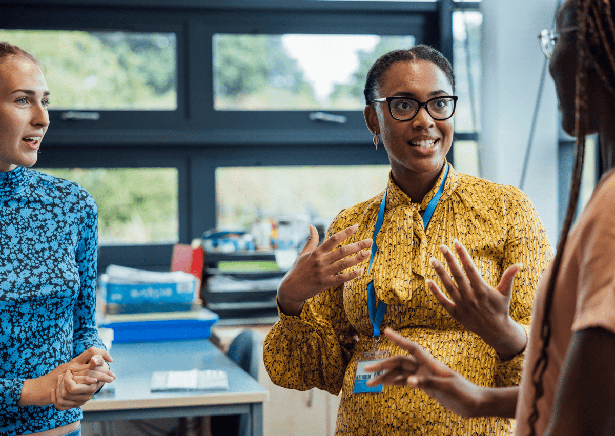 A teacher is having a conversation with two Ofsted inspectors.