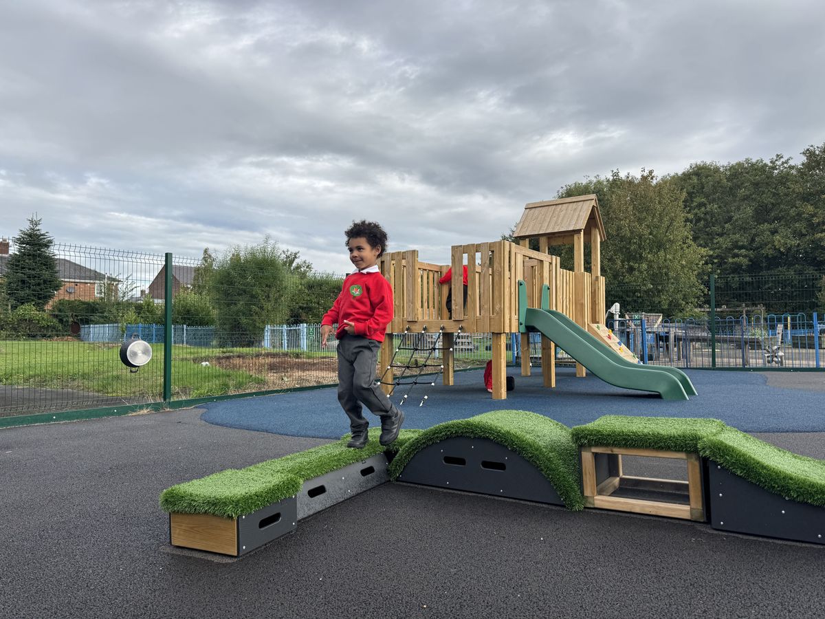 A child navigating their way across a Get Set Go blocks obstacle course.