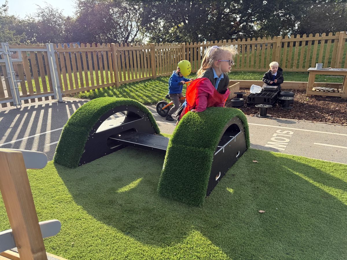 A group of primary school children are playing with the Rockies Movable Blocks, a piece of play equipment that can be acquired through the Sports Premium funding.
