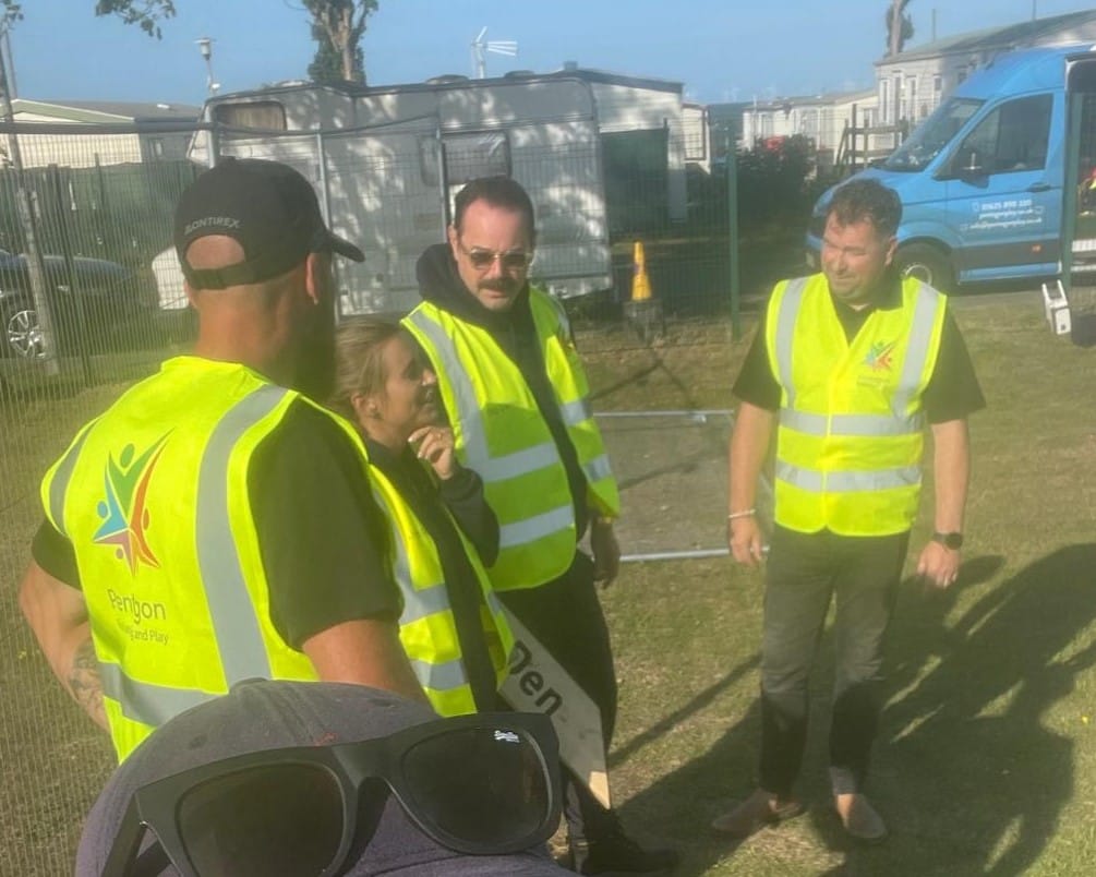 A picture of the Dyers talking to Mike and our installation team at the site.