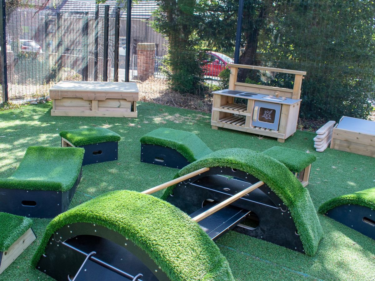A Play in a Day EYFS Freestanding Package placed on a playground.