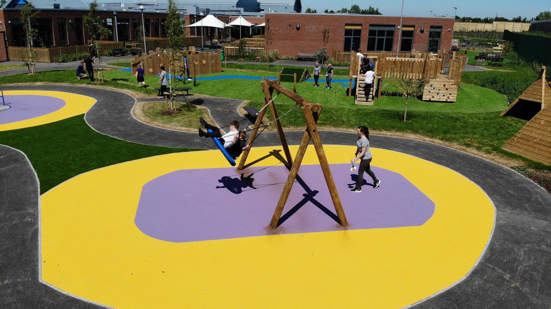 children running around on our wetpour surfacing
