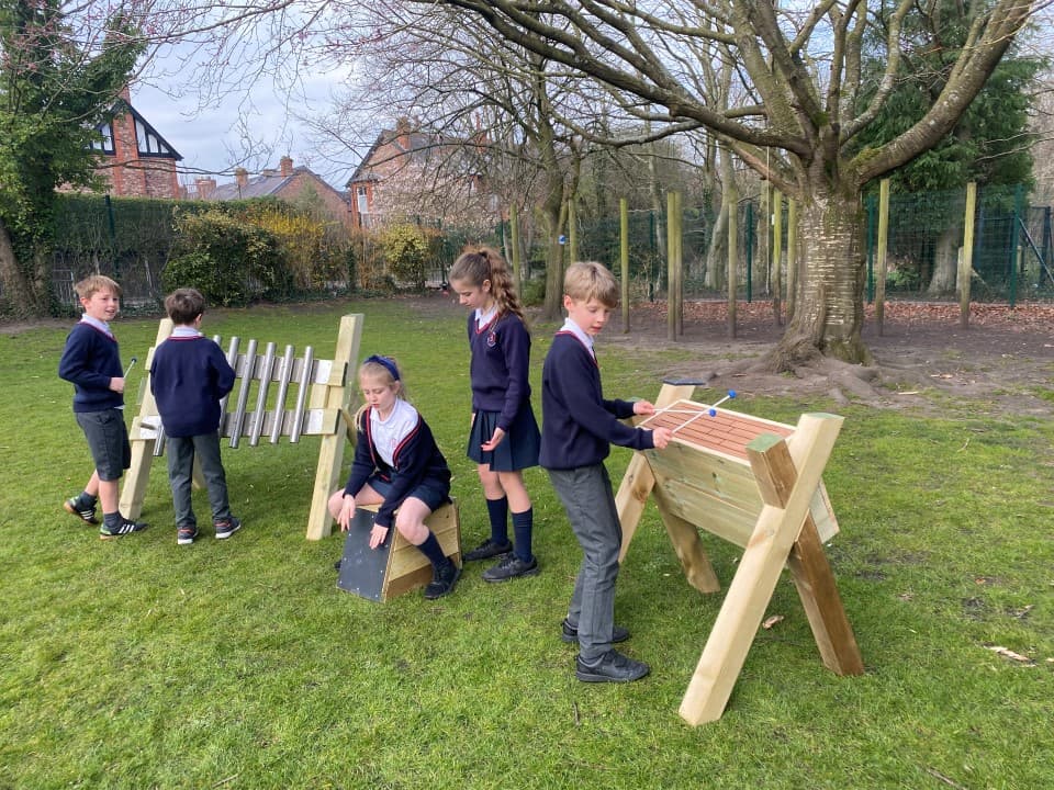 children play on the musical instruments in the music pack