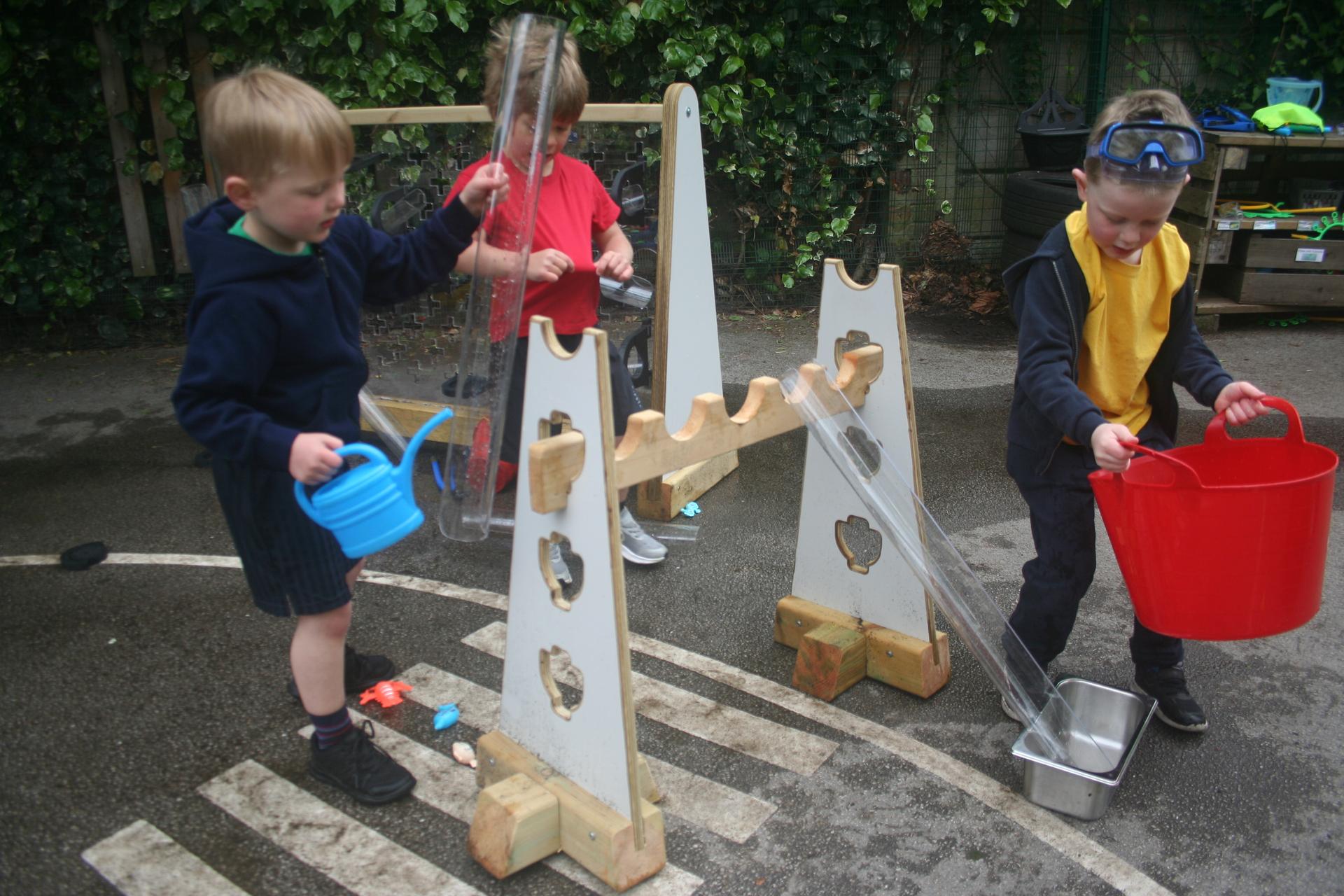 Three children assembling together Water Channel Stands 