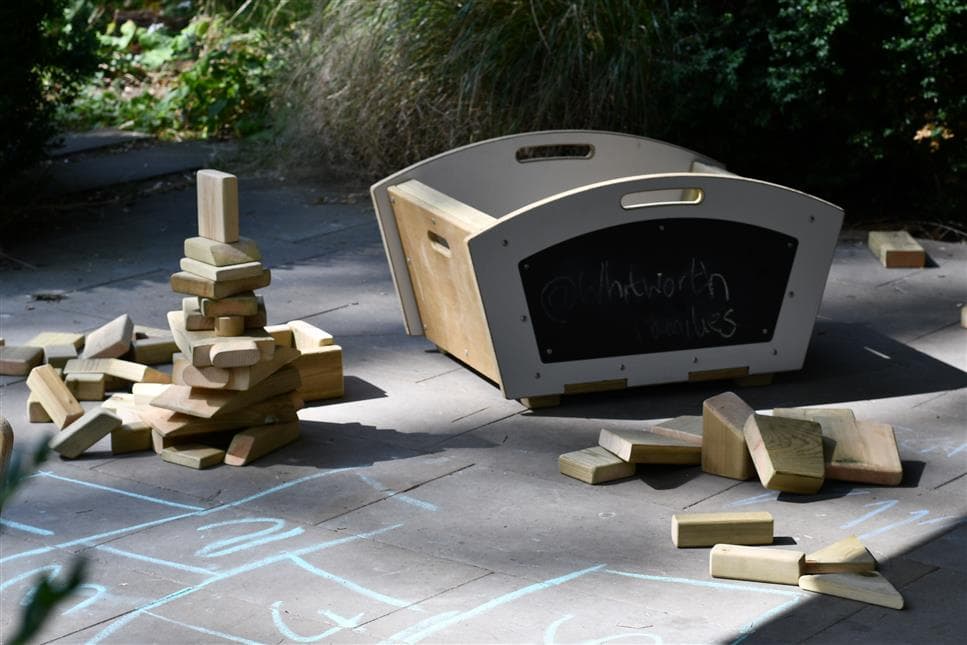 A side view of the mini skip and blocks by the side