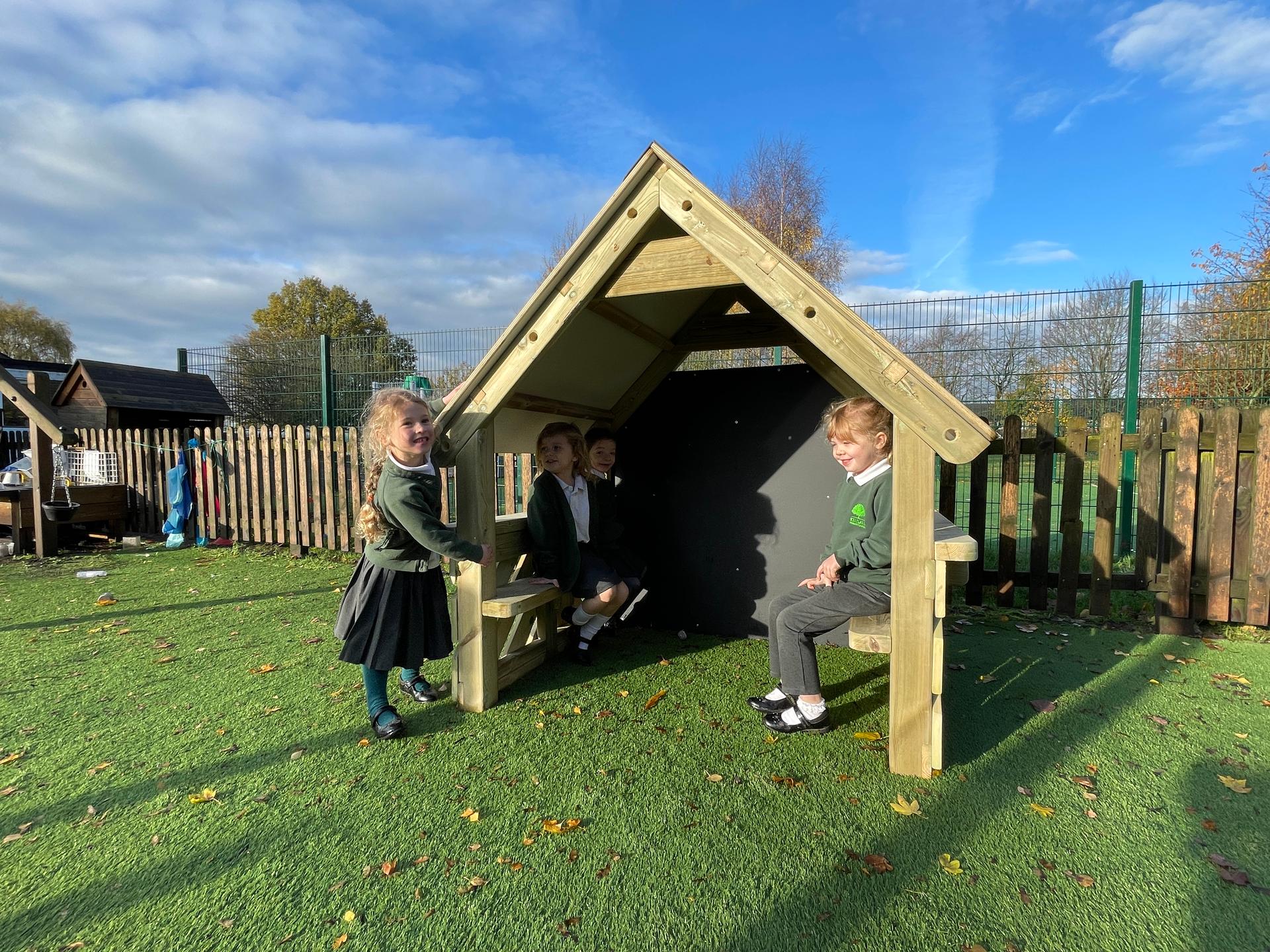 A small playhouse in a primary setting 