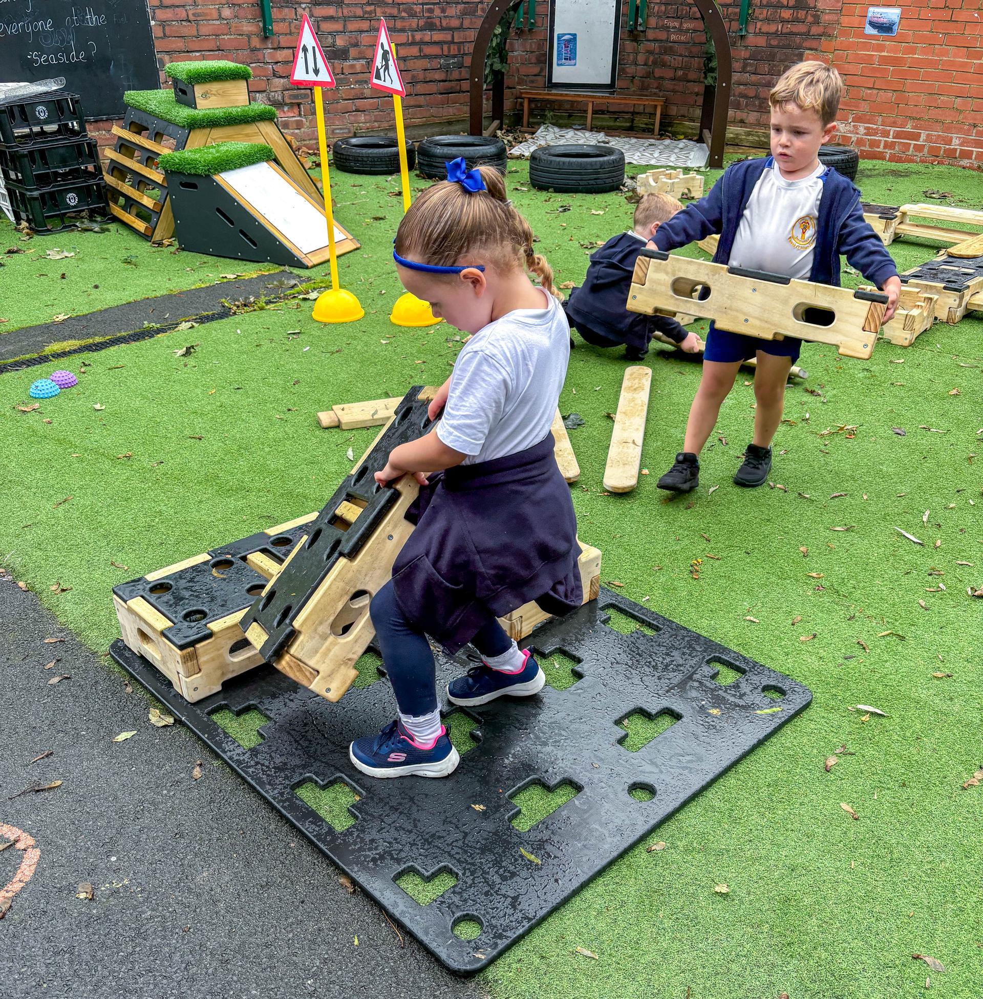 Child stacking up Play Builder Engineer set