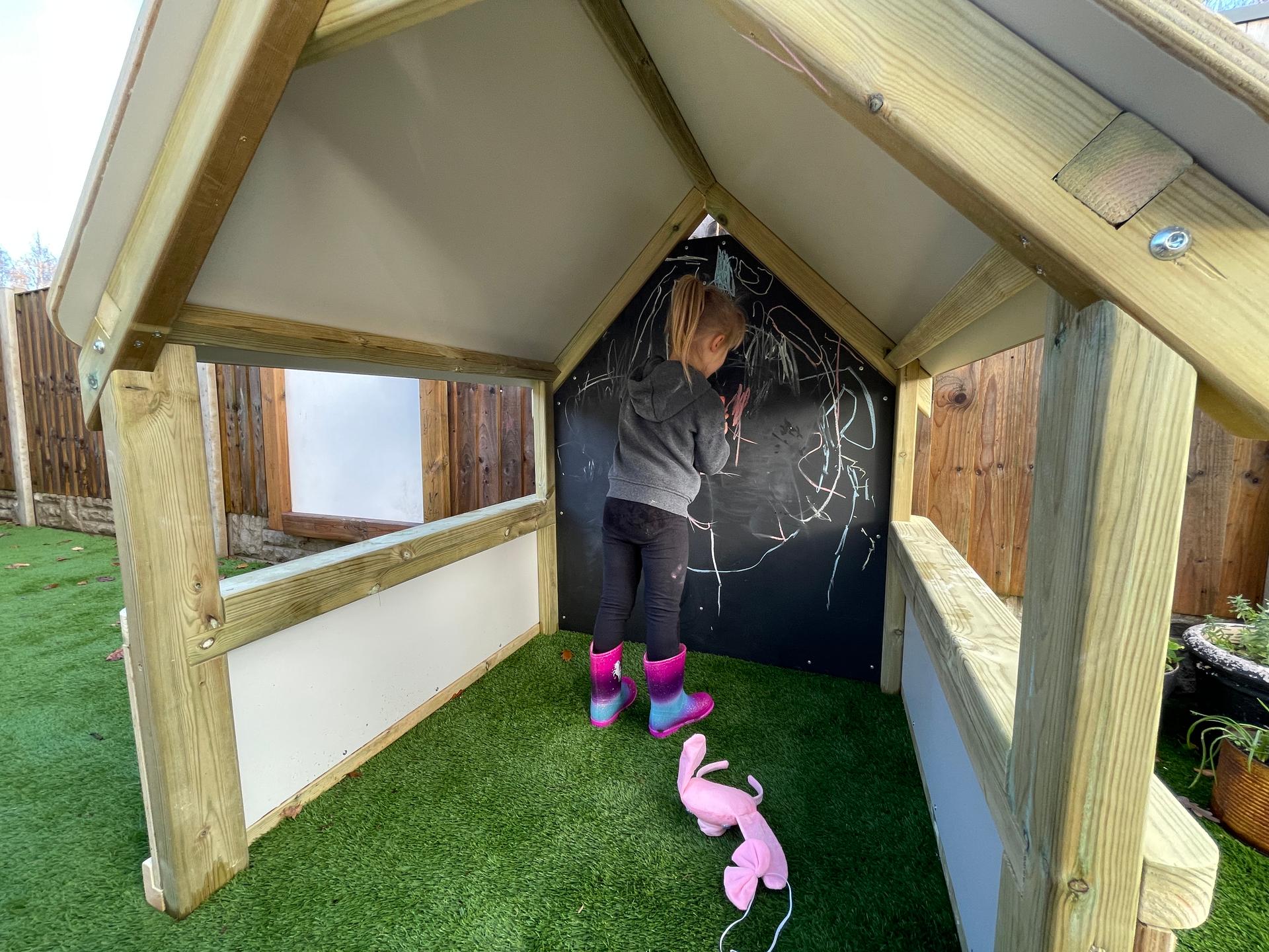 Children can build their fine motor skills through drawing on the mark-making back panel