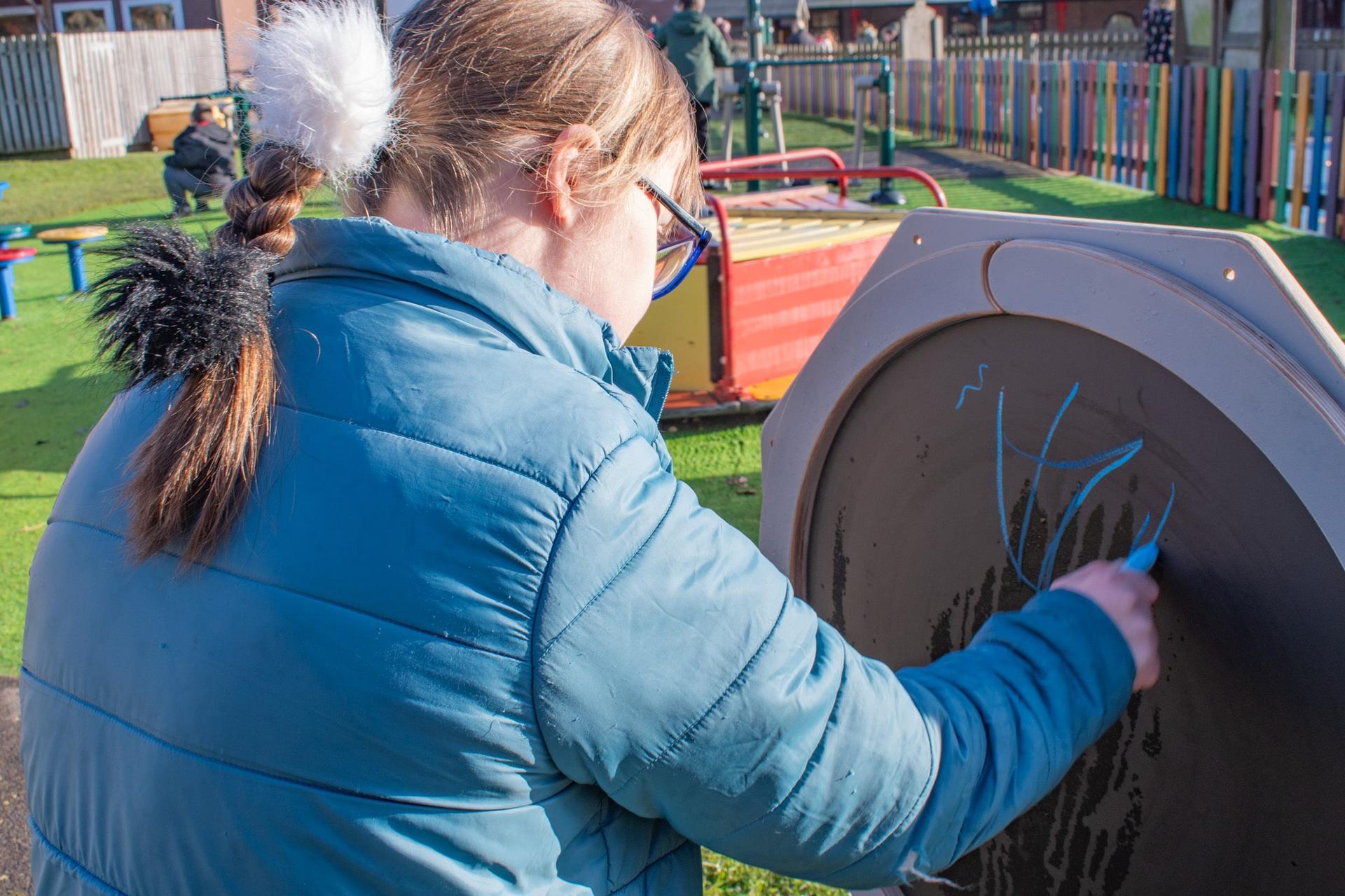 SEN Child Drawing on Drawing Sensory Spinner