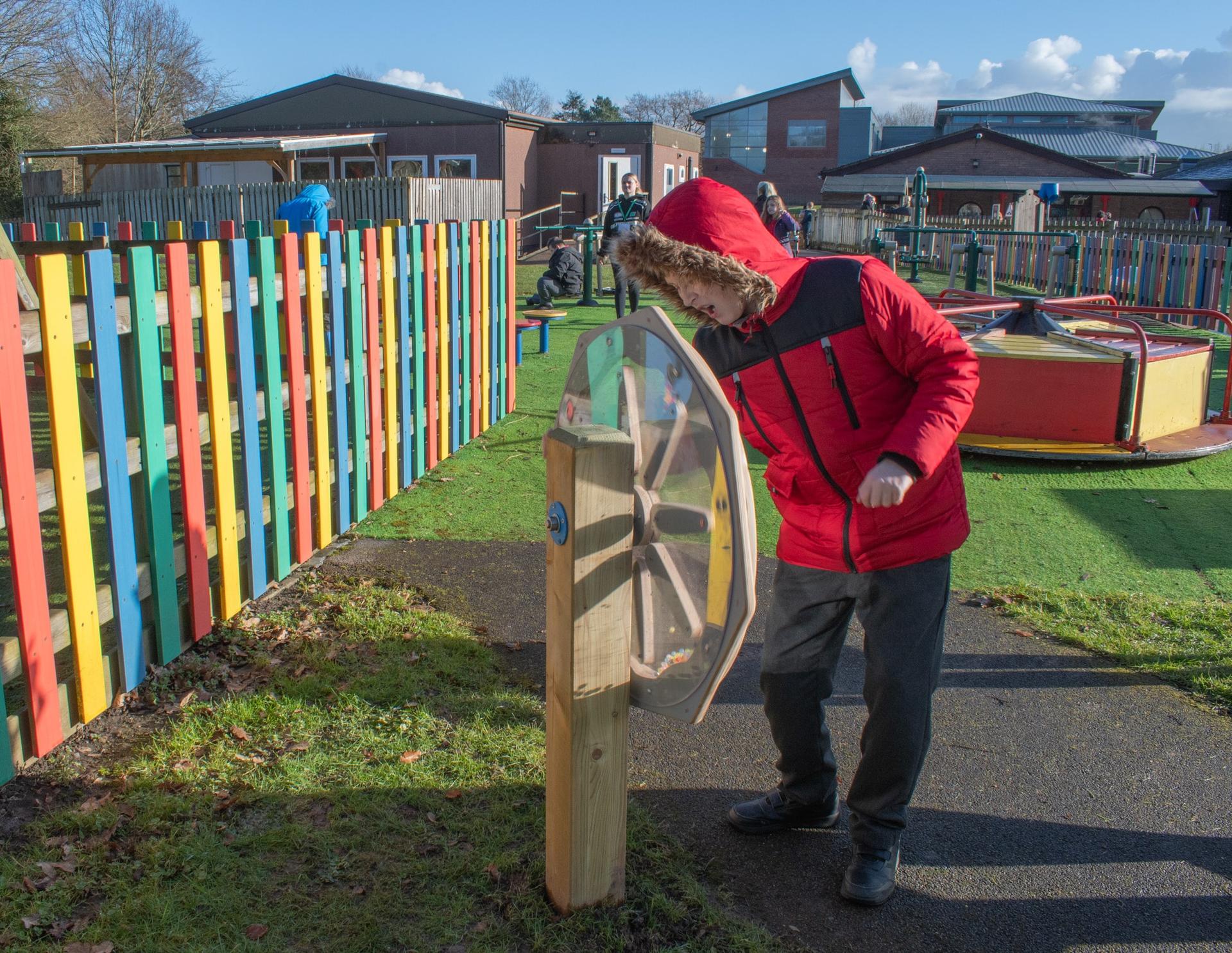 SEN Child Playing with Sound Sensory Spinner