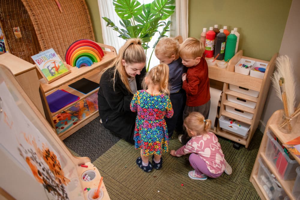 Teacher and children playing with Millhouse Expressive Arts and Design Zone