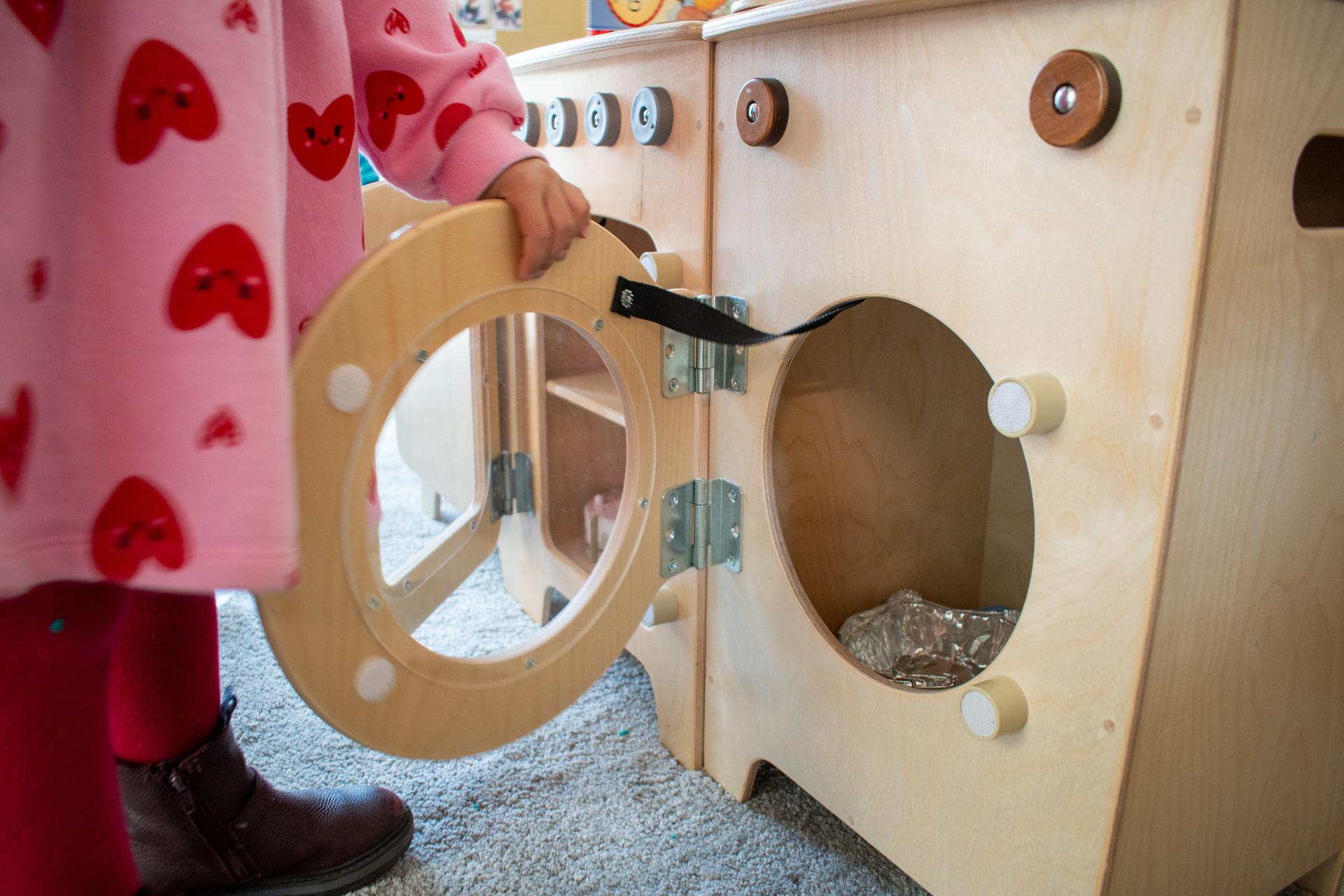 Child opening Millhouse Washing Machine Role Play Item