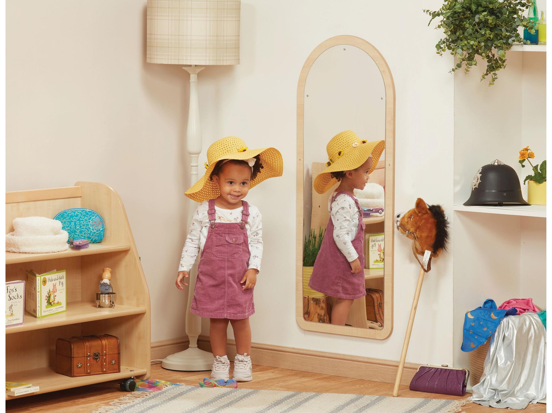 millhouse freestanding mirrow with child dressed up in nursery setting