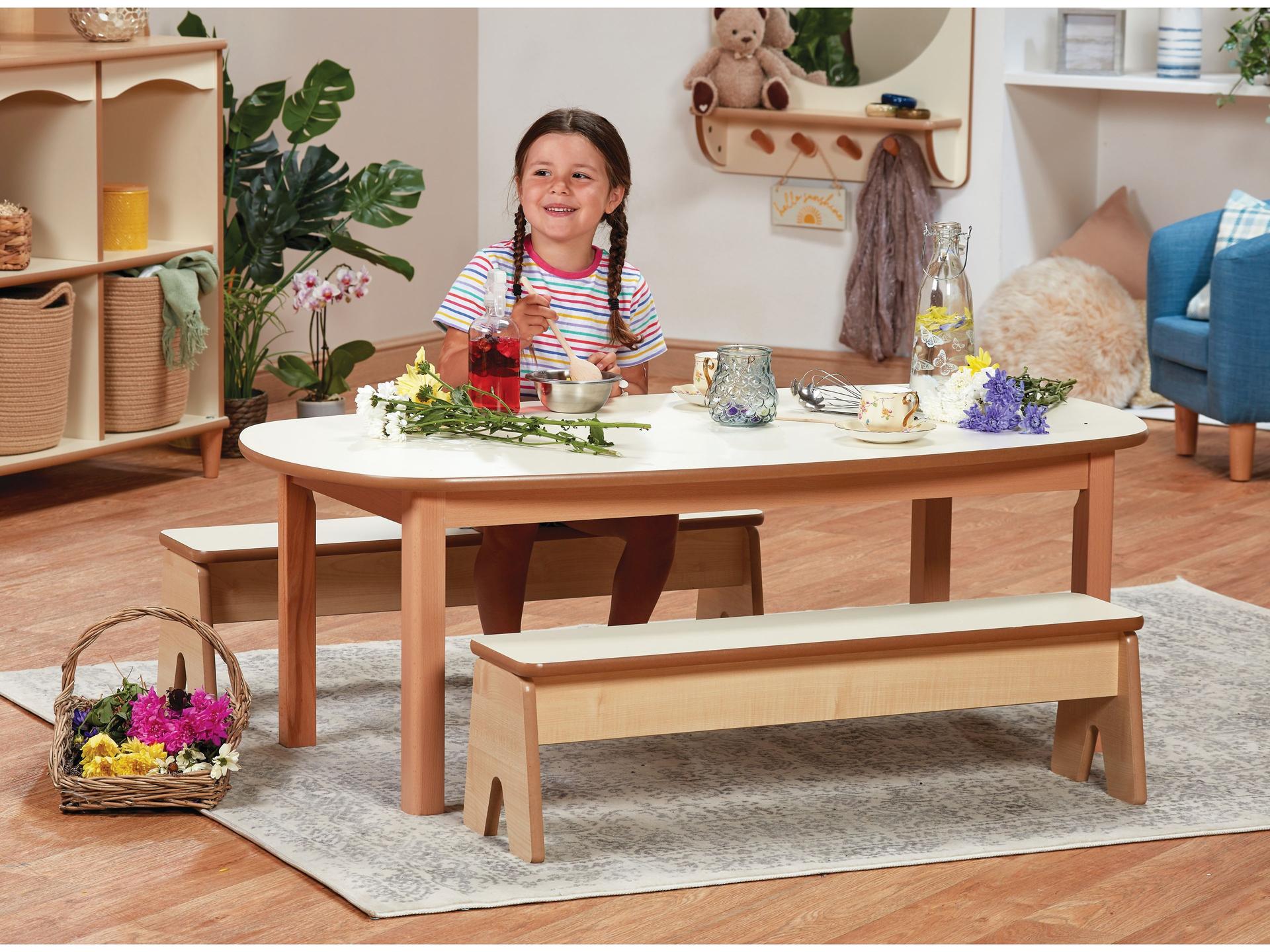 millhouse wooden bench and table with whte tops and child sat