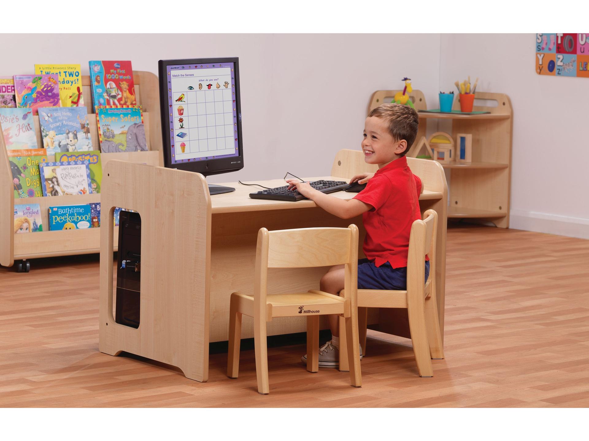 millhouse computer desk and chair with child smiling