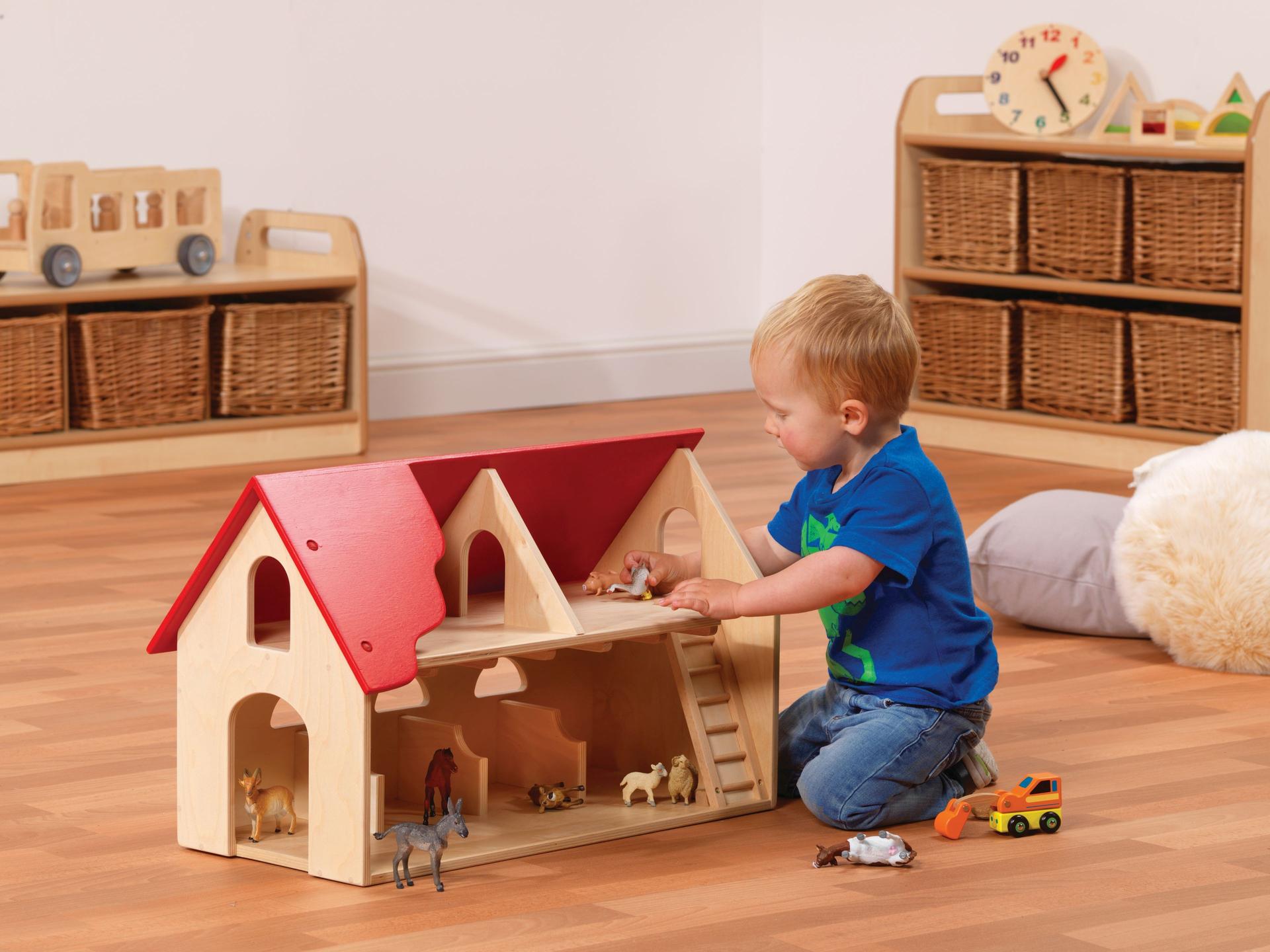 millhouse doll house with farm animal toys and toddler playing