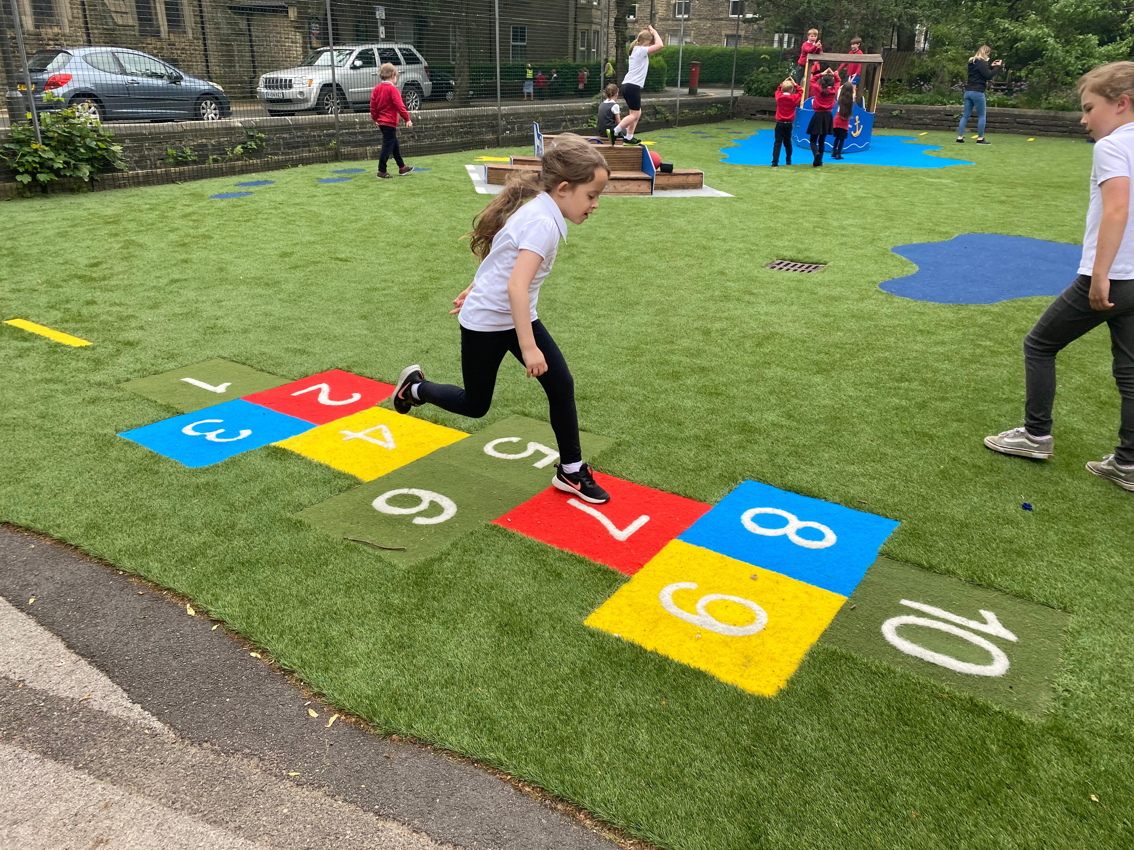 children playing on hopscotch surfacing