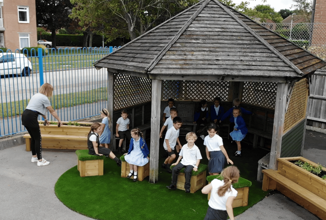 the artificial grass surfacing below a pre-built-gazebo