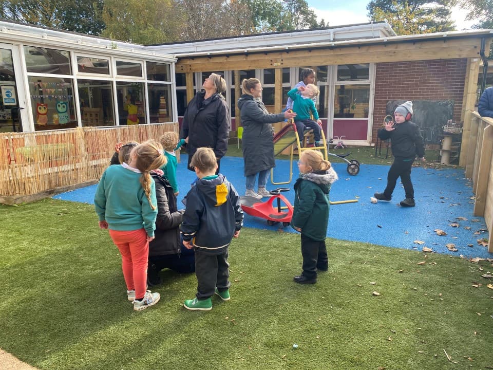 artificial grass playturf next to blue wetpour surfacing