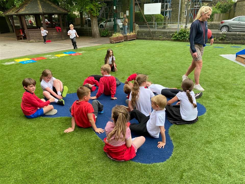 children sat on our wetpour splash