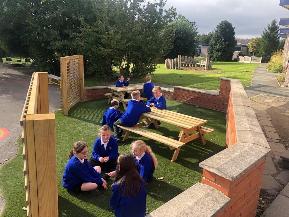 children sit in the communal seating area