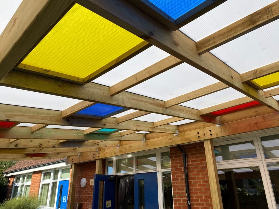 timber canopy with coloured roof panels