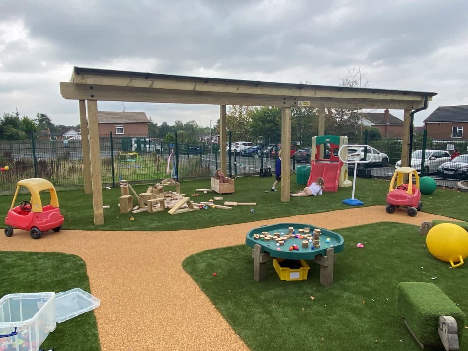 canopy at school with grass surfacing below
