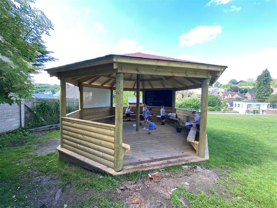 a full picture of our 5m gazebo, with children playing inside 
