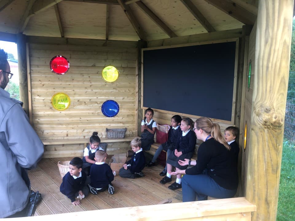 a view into the hexagonal gazebo with red, yellow and blue bubble windows