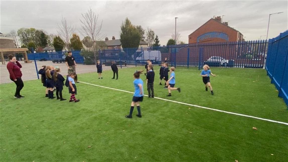 children playing football in the MUGA pitch