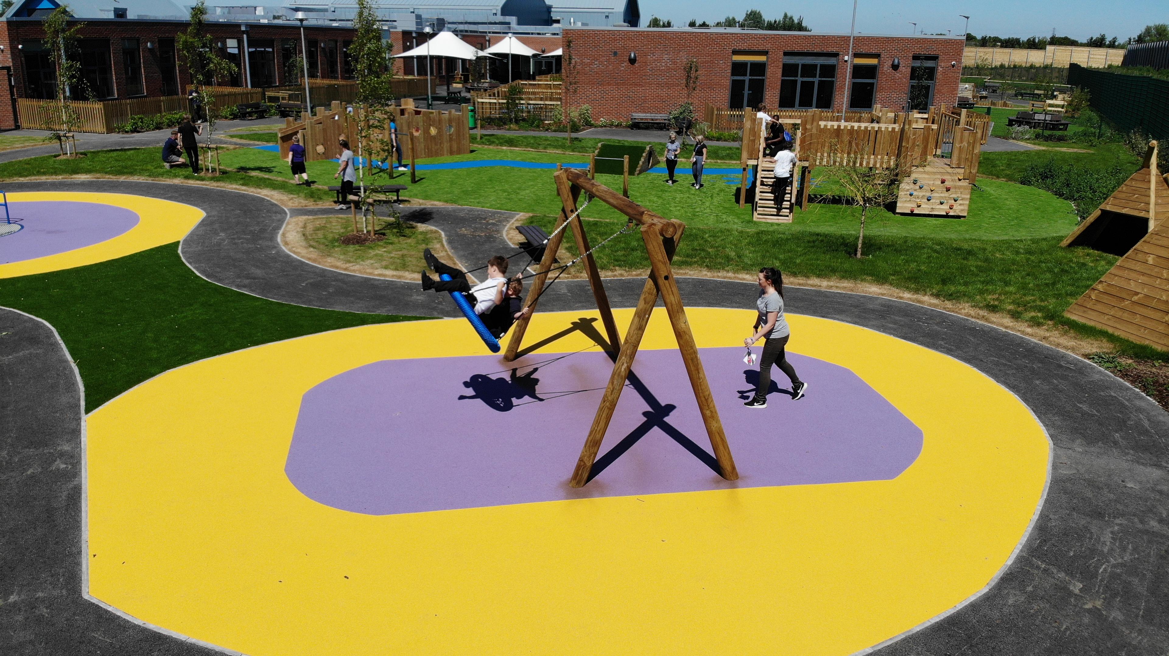 children running around on our wetpour surfacing